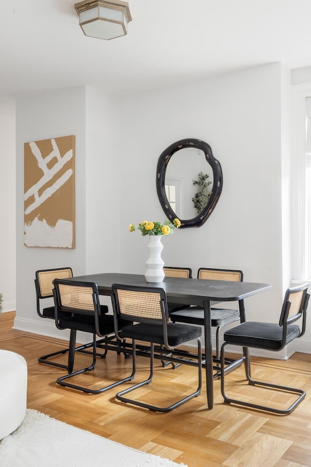 99 E 4th St Unit 4A, New York City, NY 10003 - dining space with baseboards and wood finished floors