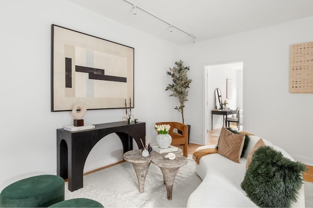 99 E 4th St Unit 4A, New York City, NY 10003 - sitting room featuring track lighting, baseboards, and wood finished floors