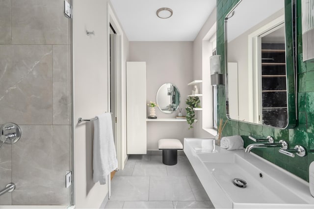 99 E 4th St Unit 4A, New York City, NY 10003 - bathroom with tile patterned floors, a shower stall, and vanity