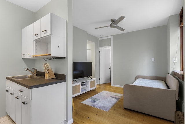508 E 78th St Unit 4-G, New York City, NY 10075 - living room featuring ceiling fan, light wood-style floors, and baseboards