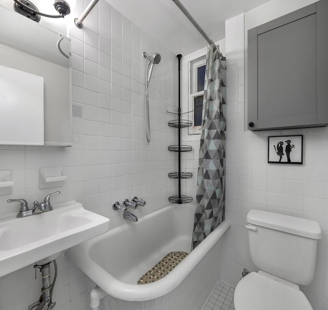 508 E 78th St Unit 4-G, New York City, NY 10075 - bathroom with tile walls, tiled shower / bath combo, toilet, and backsplash