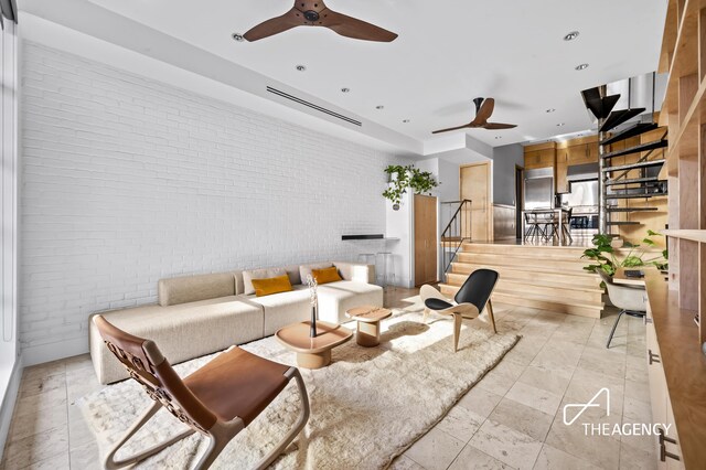 8 Charles Ln Unit A, New York City, NY 10014 - living area with brick wall, a ceiling fan, stairs, and recessed lighting