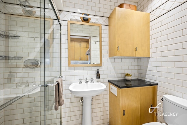 8 Charles Ln Unit A, New York City, NY 10014 - full bath featuring tile walls, tasteful backsplash, and a shower stall