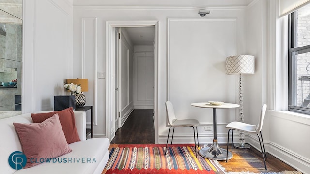 living area featuring plenty of natural light and wood finished floors
