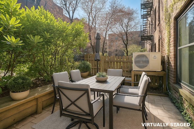 view of patio with outdoor dining area and a cooling unit
