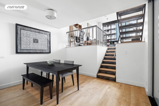 77 Bleecker St Unit 810, New York City, NY 10012 - dining space featuring stairs, baseboards, and hardwood / wood-style floors