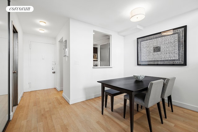 77 Bleecker St Unit 810, New York City, NY 10012 - dining room with light wood-style flooring and baseboards