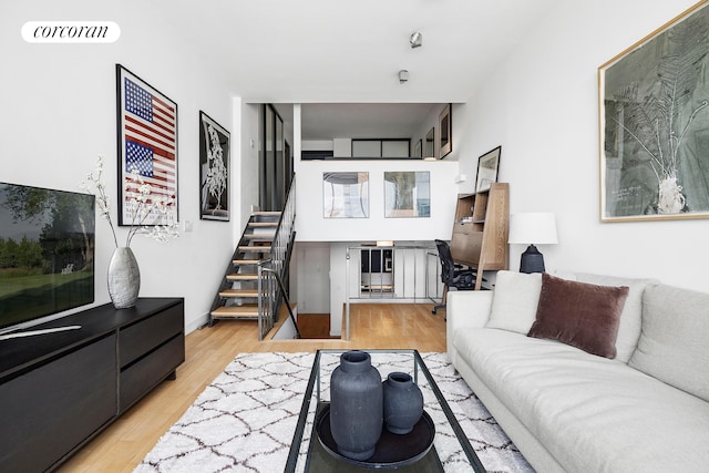 77 Bleecker St Unit 810, New York City, NY 10012 - living area featuring stairway and wood finished floors