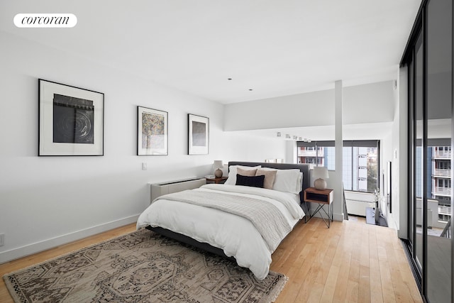 77 Bleecker St Unit 810, New York City, NY 10012 - bedroom with light wood-style floors and baseboards