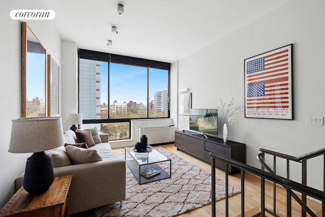 77 Bleecker St Unit 810, New York City, NY 10012 - living room with wood finished floors
