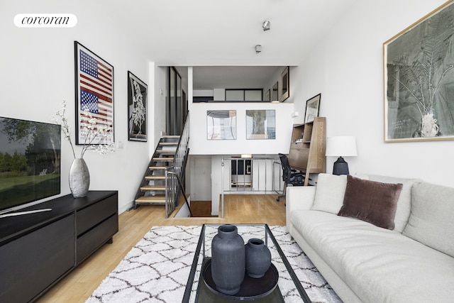 77 Bleecker St Unit 810, New York City, NY 10012 - living area with stairs and wood finished floors