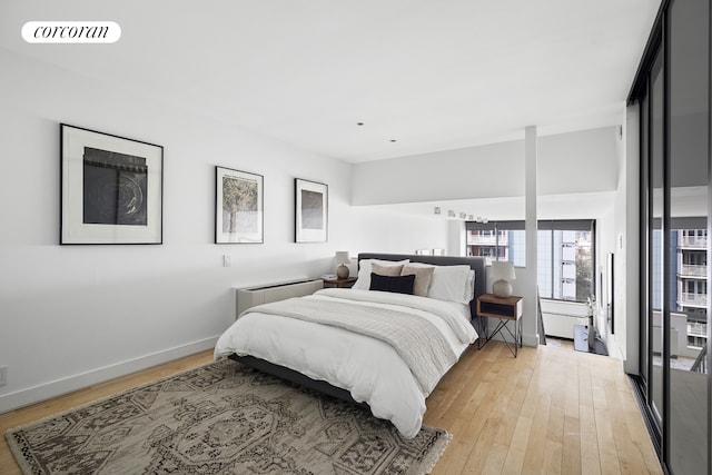 77 Bleecker St Unit 810, New York City, NY 10012 - bedroom featuring light wood finished floors and baseboards