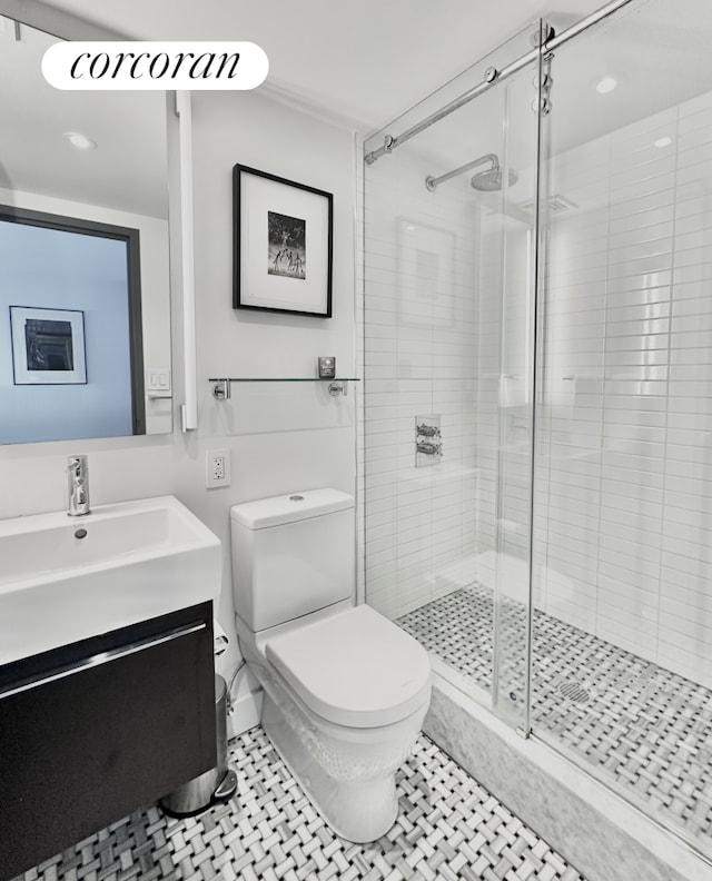 77 Bleecker St Unit 810, New York City, NY 10012 - bathroom featuring toilet, a shower stall, vanity, and recessed lighting