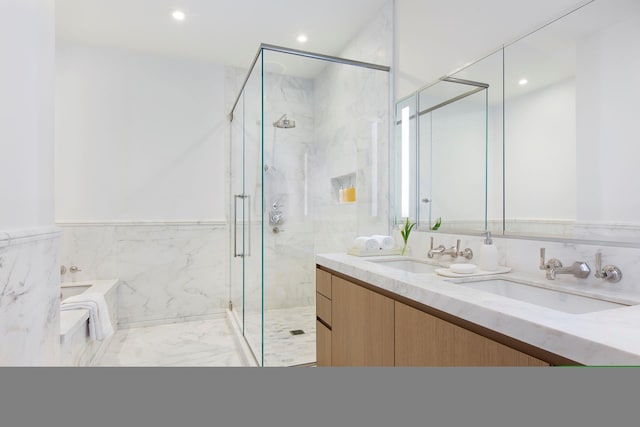 215 E 19th St Unit 2K, New York City, NY 10003 - full bathroom with a bath, a marble finish shower, double vanity, recessed lighting, and marble finish flooring