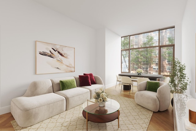 215 E 19th St Unit 2K, New York City, NY 10003 - living area featuring baseboards and wood finished floors