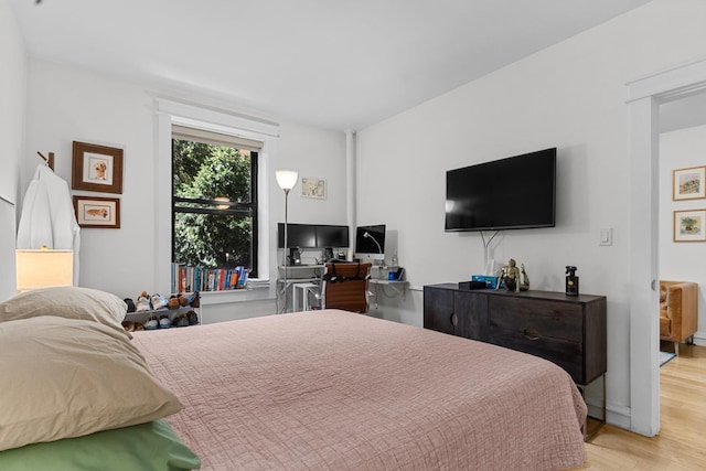 bedroom featuring light wood-style floors