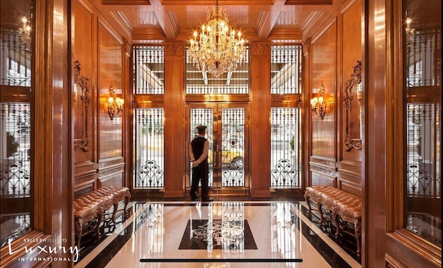 502 Park Ave Unit 12J, New York City, NY 10022 - community lobby featuring crown molding, a high ceiling, and a decorative wall