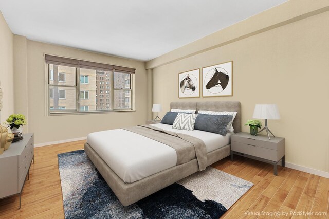 415 E 52nd St Unit 5-Mc, New York City, NY 10022 - bedroom featuring light wood-type flooring and baseboards