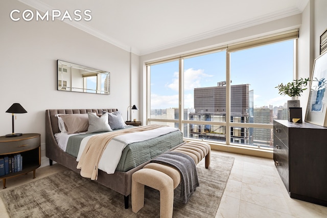 bedroom featuring multiple windows, ornamental molding, and a view of city
