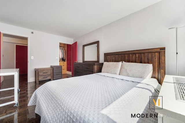 4-74 48th Ave Unit 8-M, New York City, NY 11109 - bedroom featuring baseboards, wood finished floors, and a closet
