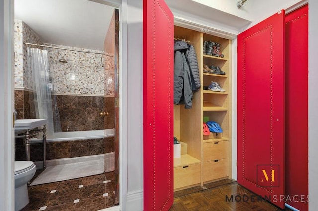 4-74 48th Ave Unit 8-M, New York City, NY 11109 - full bathroom featuring tiled shower / bath and toilet