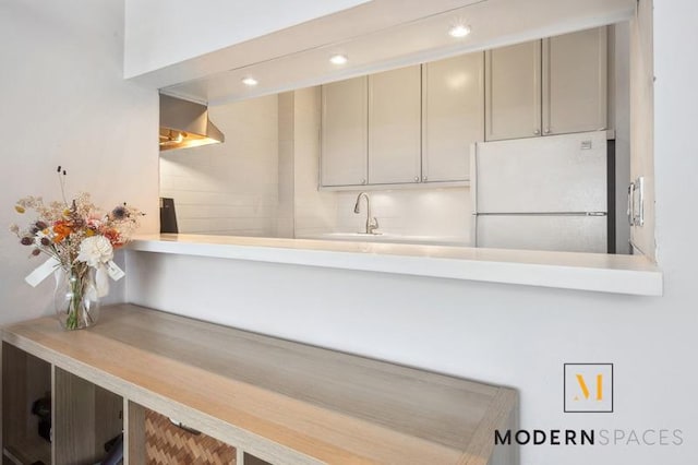 4-74 48th Ave Unit 8-M, New York City, NY 11109 - kitchen featuring freestanding refrigerator, a sink, gray cabinets, and recessed lighting
