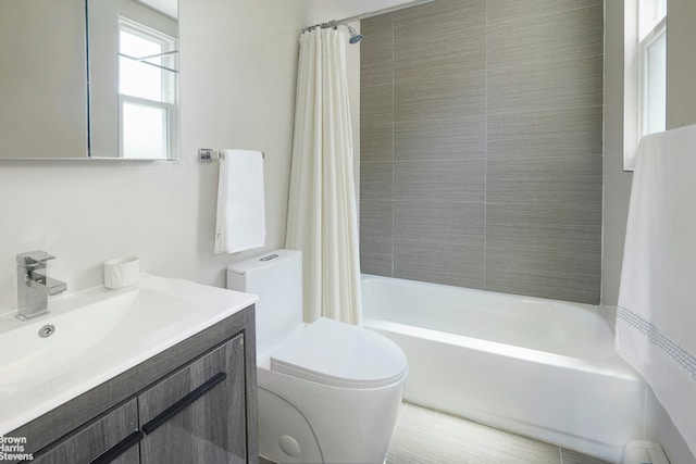 full bath featuring shower / bath combination with curtain, toilet, and vanity