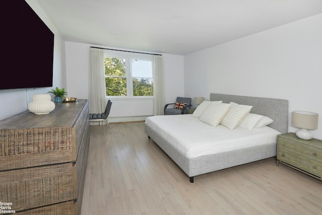 bedroom with light wood-style floors