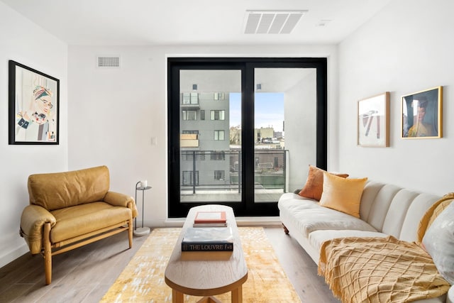 44 Box St Unit 5C, New York City, NY 11222 - living area featuring wood finished floors and baseboards