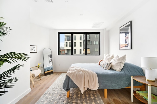 44 Box St Unit 5C, New York City, NY 11222 - bedroom featuring light wood-type flooring and baseboards