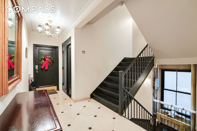 1060 Park Ave Unit 11A, New York City, NY 10128 - foyer with a chandelier, baseboards, stairs, and crown molding