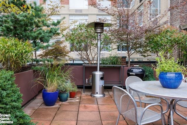 view of patio featuring outdoor dining space and fence
