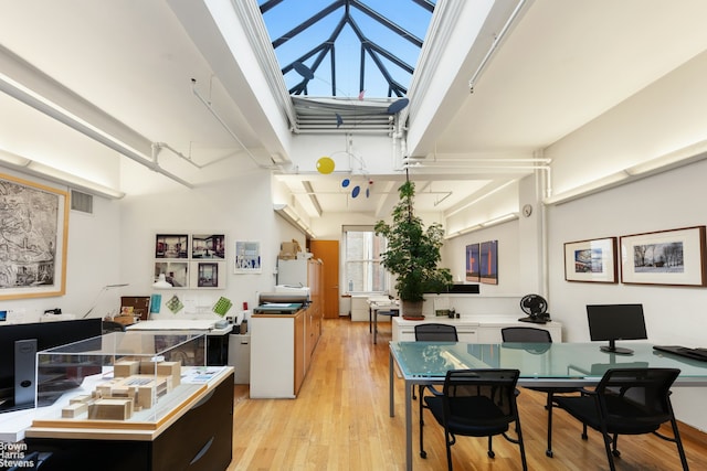 118 E 25th St Unit Ph12Thfl, New York City, NY 10010 - dining area featuring light wood finished floors and a desk