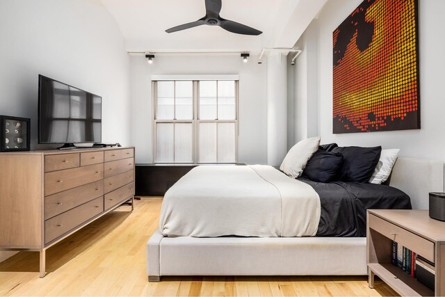 bedroom featuring light wood-type flooring and a ceiling fan