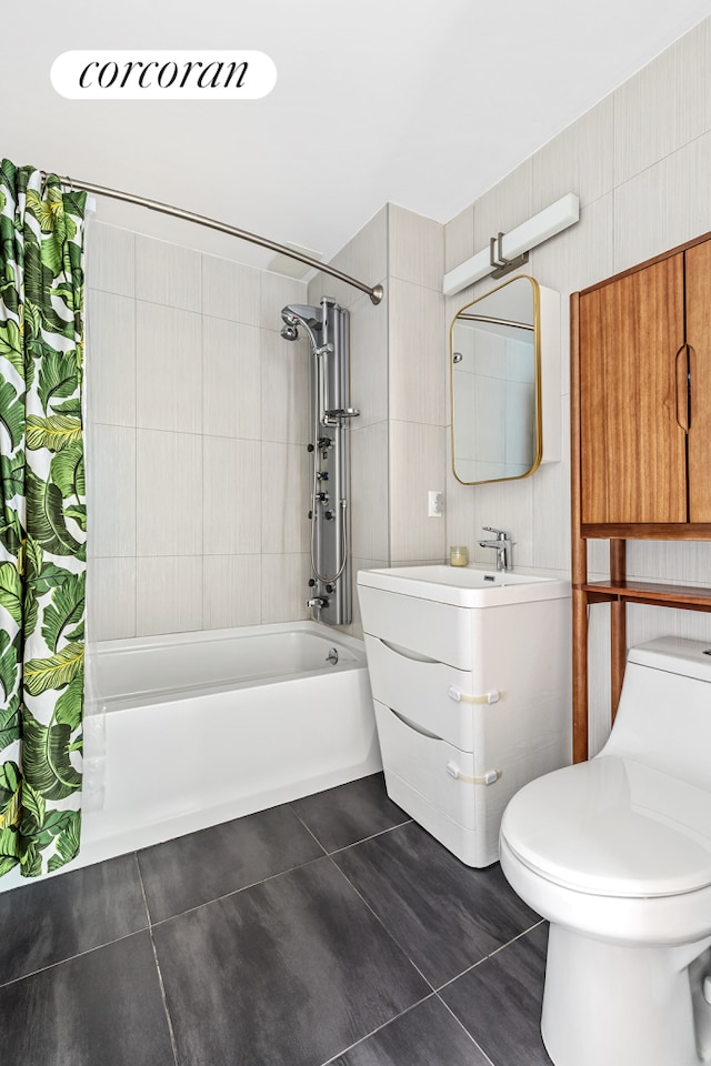 bathroom with tile patterned flooring, shower / bathtub combination with curtain, toilet, and vanity