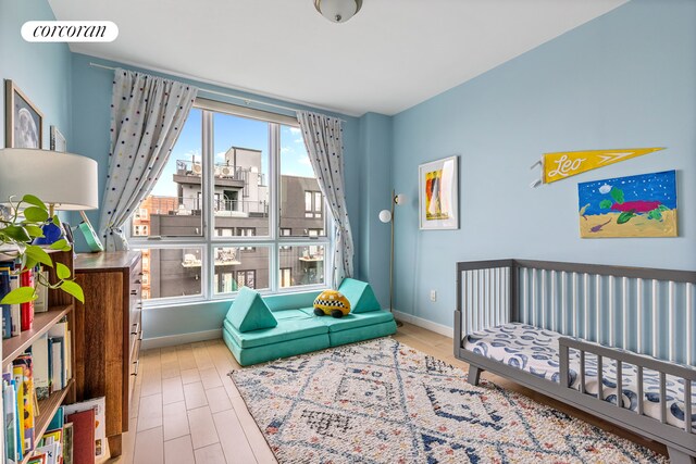 222 Parkville Ave Unit 6B, New York City, NY 11230 - bedroom with baseboards and wood finished floors