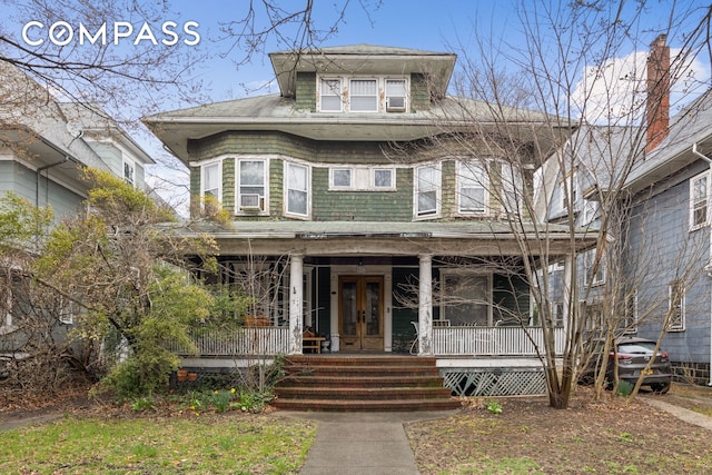 447 E 17th St, New York City, NY 11226 - american foursquare style home featuring a porch and french doors