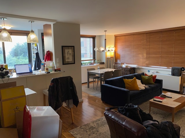 515 E 72nd St Unit 4B, New York City, NY 10021 - living room featuring wood finished floors and a chandelier
