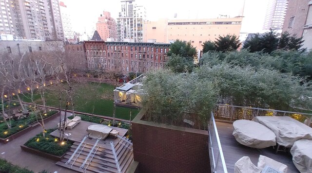 515 E 72nd St Unit 4B, New York City, NY 10021 - view of wooden balcony with a city view and a wooden deck