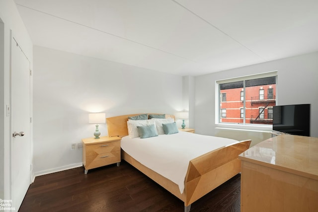 330 W 145th St Unit 505, New York City, NY 10039 - bedroom with dark wood finished floors and baseboards