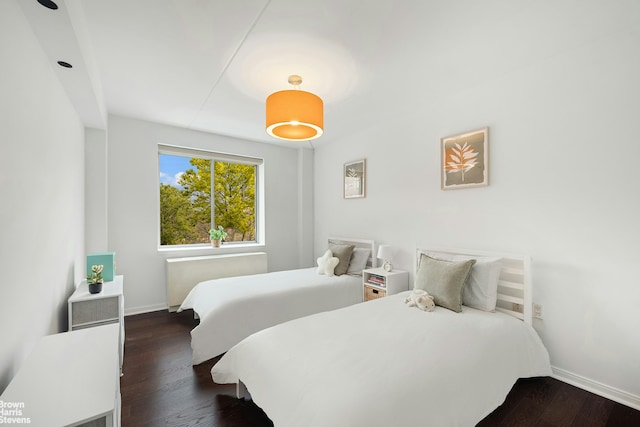 330 W 145th St Unit 505, New York City, NY 10039 - bedroom featuring baseboards and wood finished floors