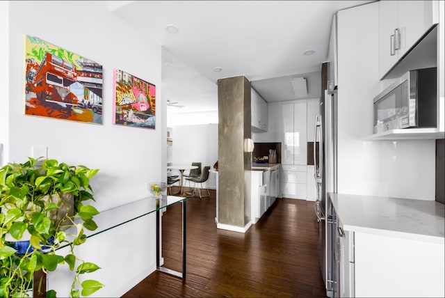 kitchen featuring modern cabinets, white cabinetry, and dark wood-type flooring