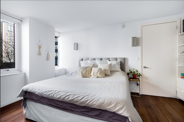 bedroom with wood finished floors