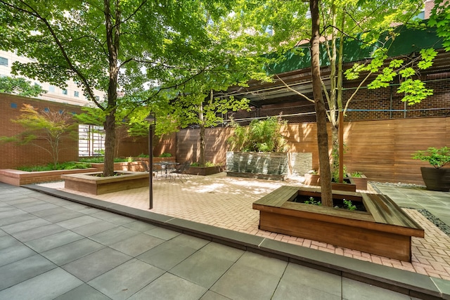 view of patio / terrace featuring fence