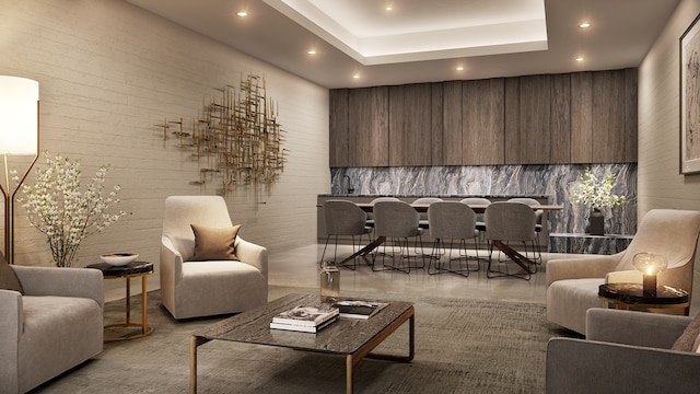 10 Nevins St Unit 26-C, New York City, NY 11217 - living room featuring recessed lighting, a tray ceiling, and brick wall