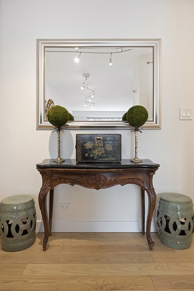 137 E 36th St Unit 11-B, New York City, NY 10016 - detailed view of wood finished floors, baseboards, and rail lighting