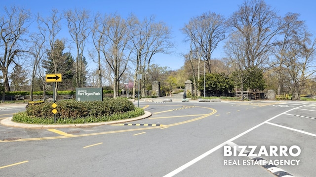 553 W 182nd St Unit 2R, New York City, NY 10033 - view of asphalt road featuring curbs and traffic signs