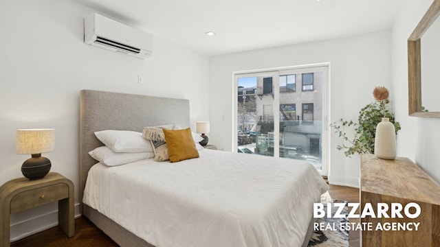 553 W 182nd St Unit 2R, New York City, NY 10033 - bedroom featuring an AC wall unit, access to outside, and wood finished floors