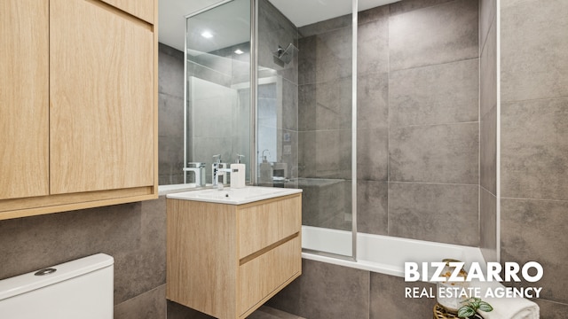 553 W 182nd St Unit 2R, New York City, NY 10033 - bathroom featuring toilet, tiled shower / bath combo, and vanity