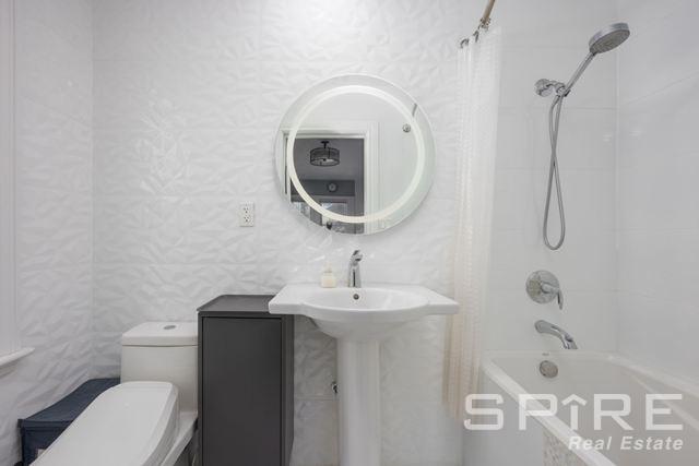 72-03 Ingram St Unit H0Use, New York City, NY 11375 - full bathroom with shower / tub combo and toilet